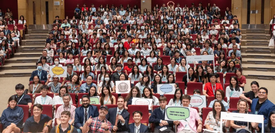 A full auditorium during a conference talk